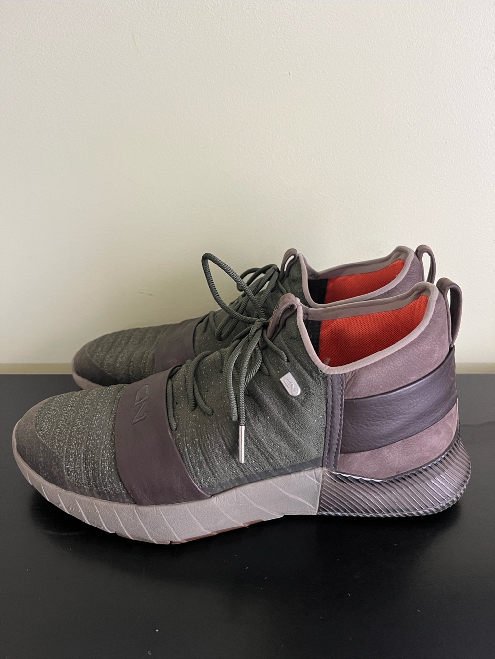 Under Armour C1N TR Lux training shoes in a downtown green